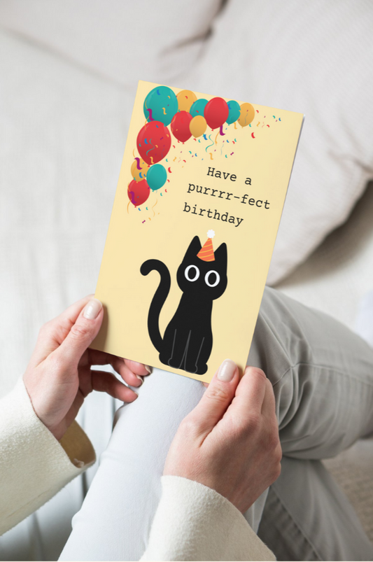 greeting card with a cat wearing a birthday hat and text that says have a purrr-fect birthday
