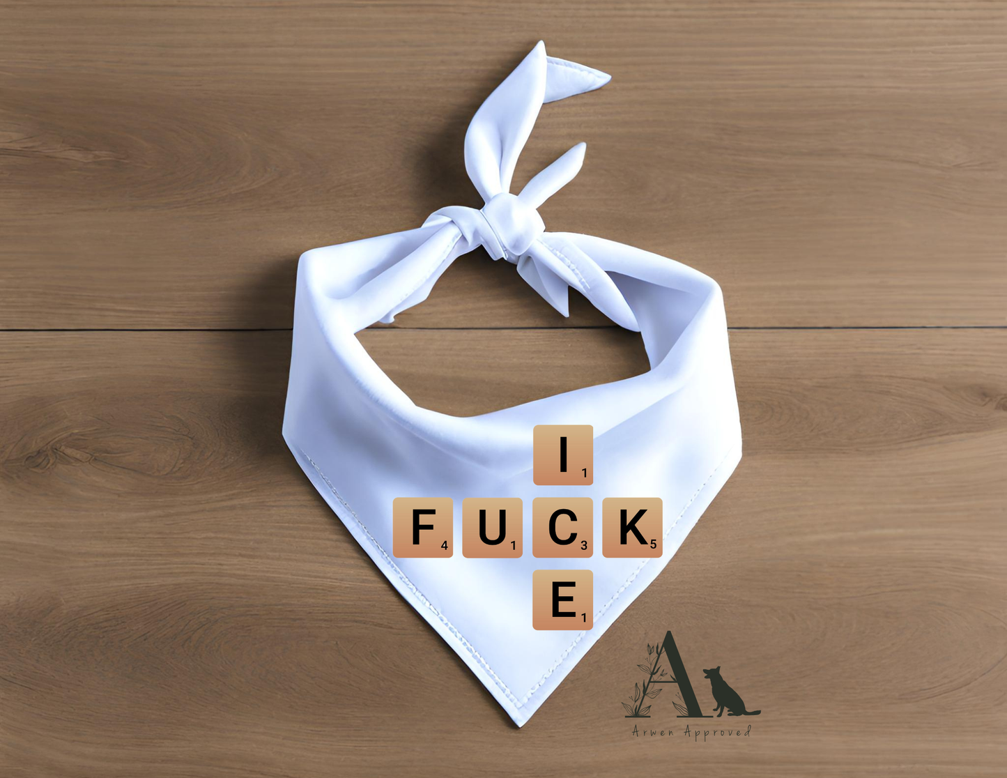 White bandana with Scrabble tile text on a wooden surface