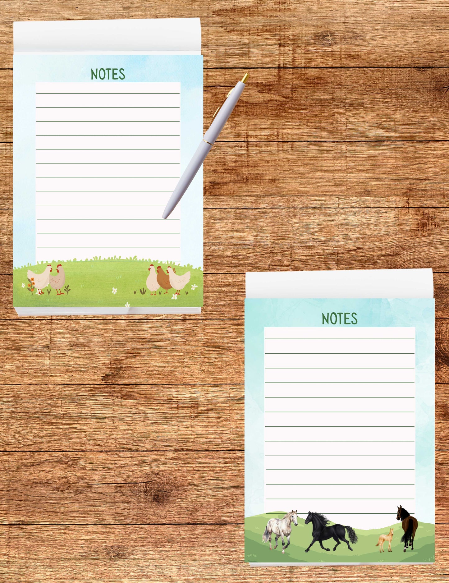 Two notepads with animal illustrations on a wooden surface
