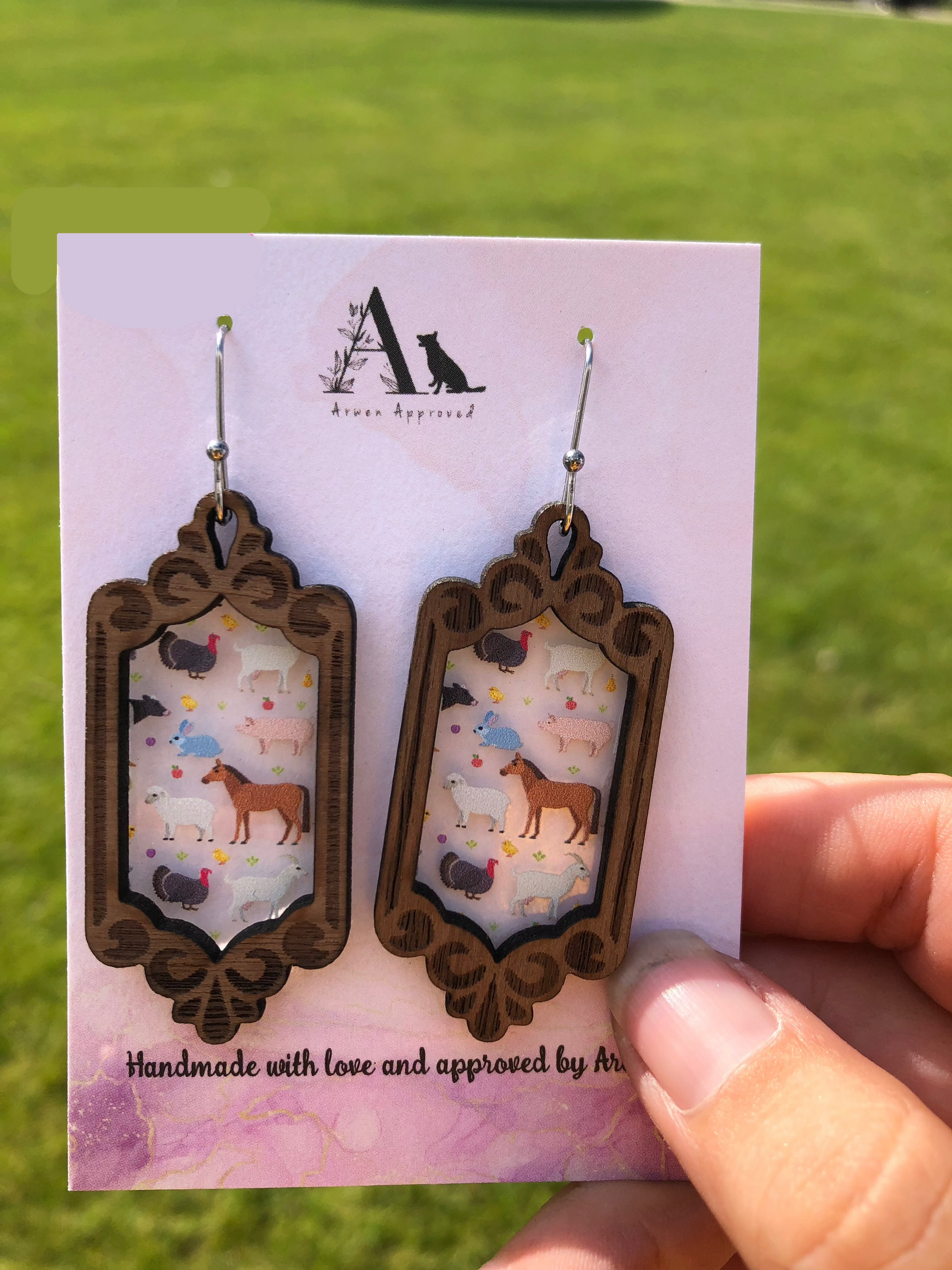 Dangle earrings with farm animals on them