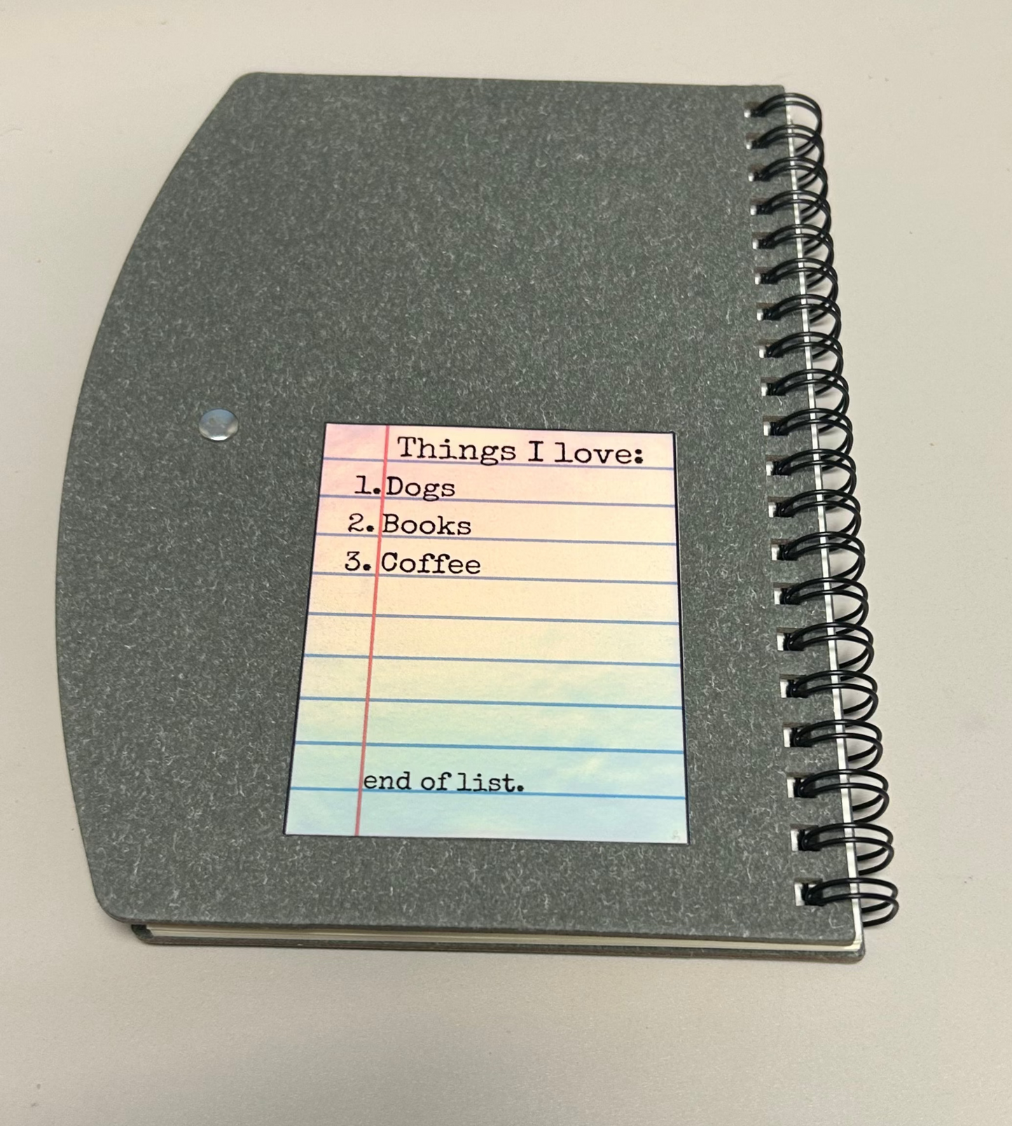 Notebook with sticker saying a list of things 'I love' on it