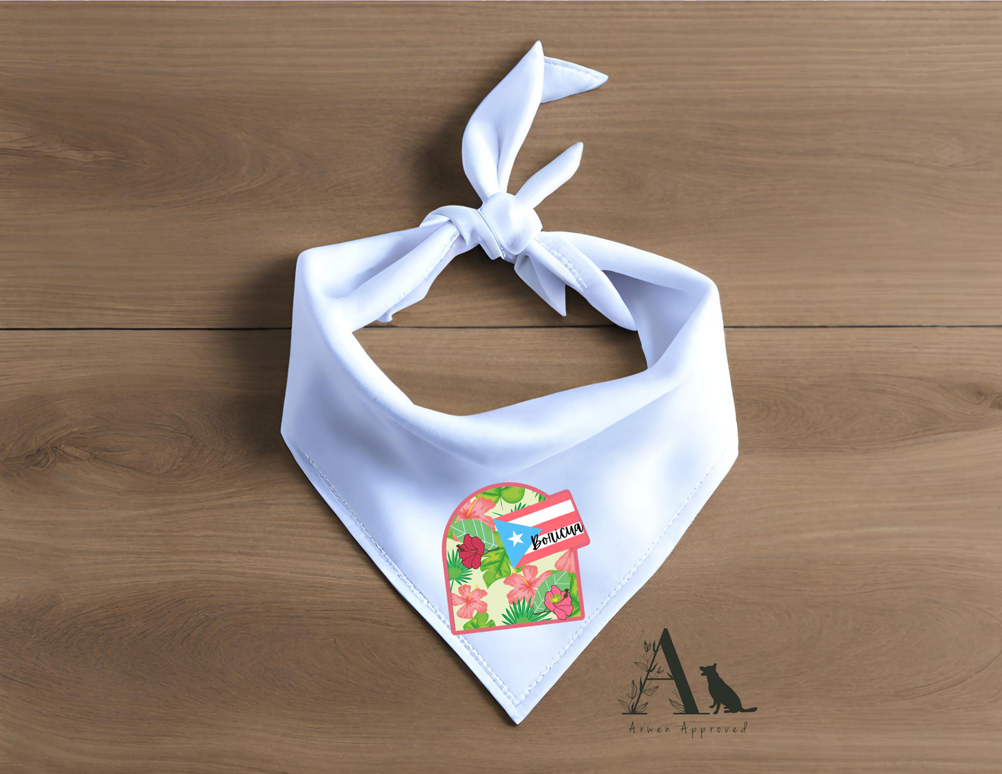 White bandana with a colorful boricua design on a wooden surface
