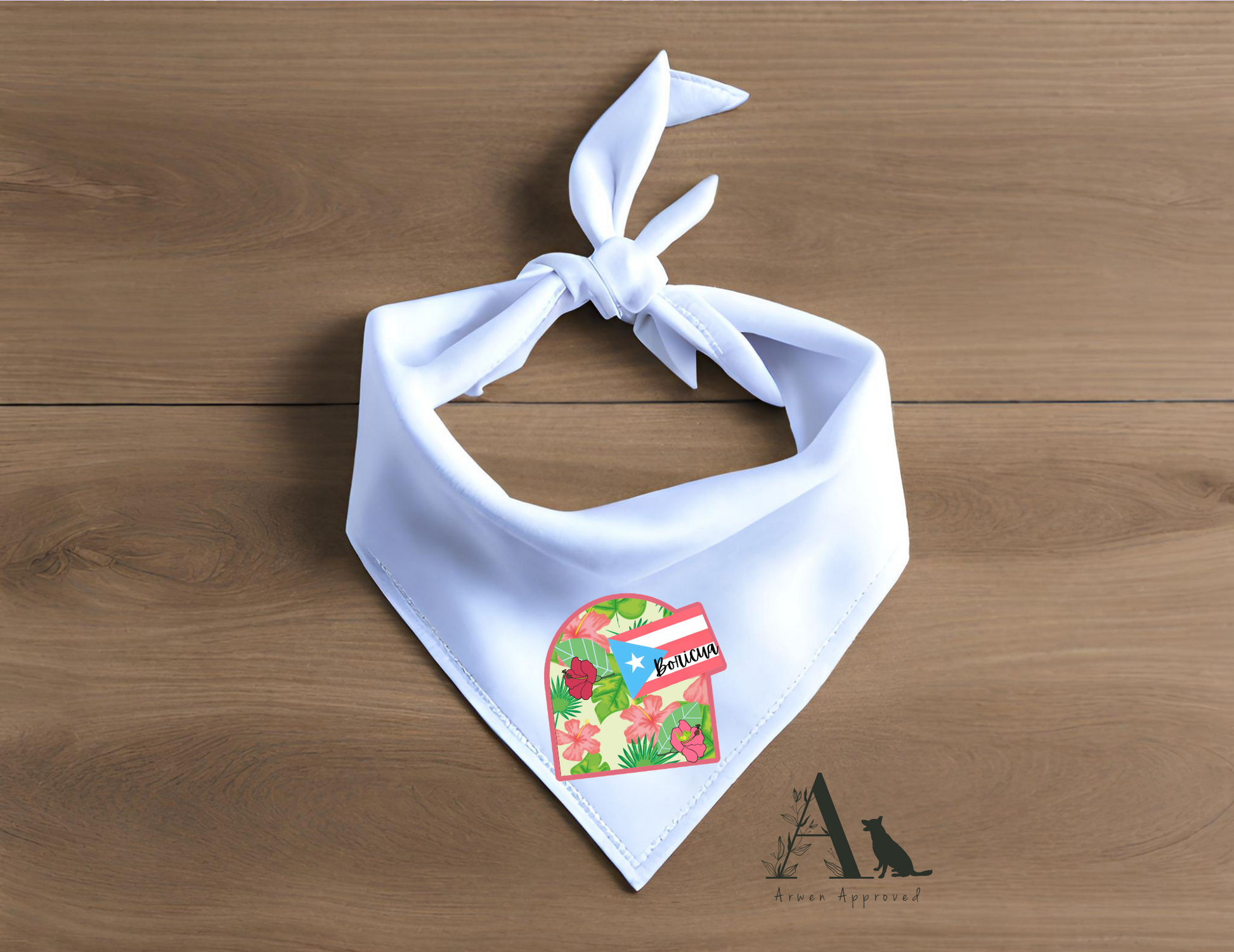 White bandana with a colorful boricua design on a wooden surface