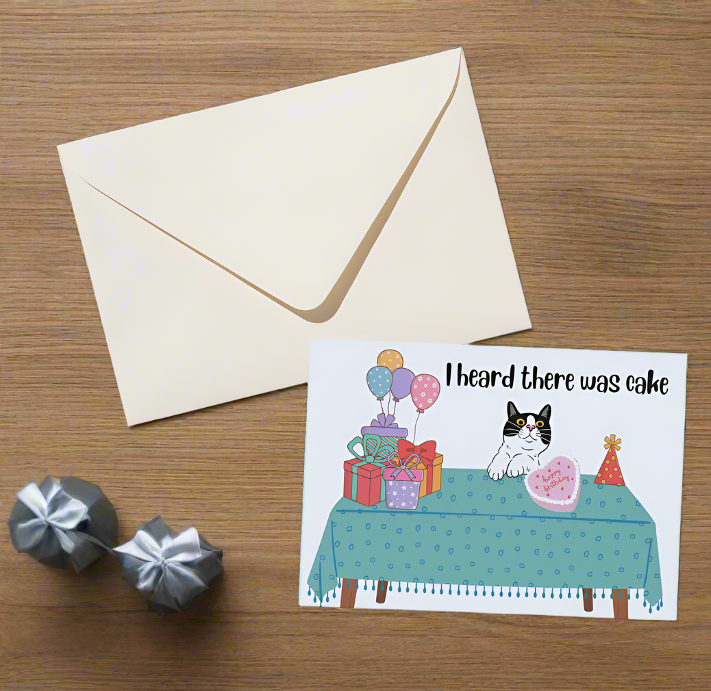 greeting card with a cat and presents on it