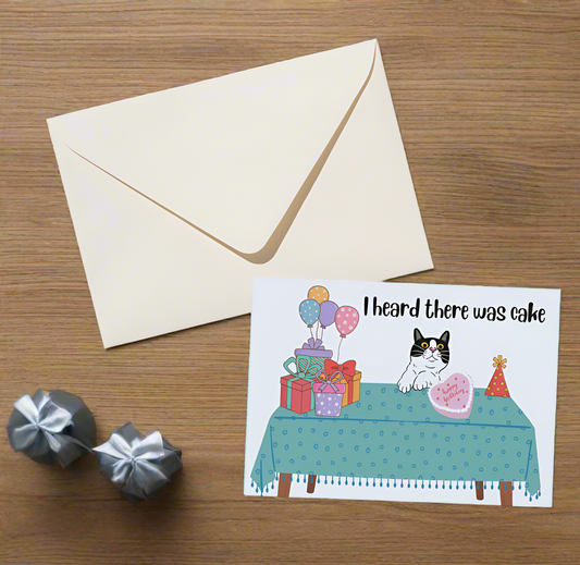 greeting card with a cat and presents on it