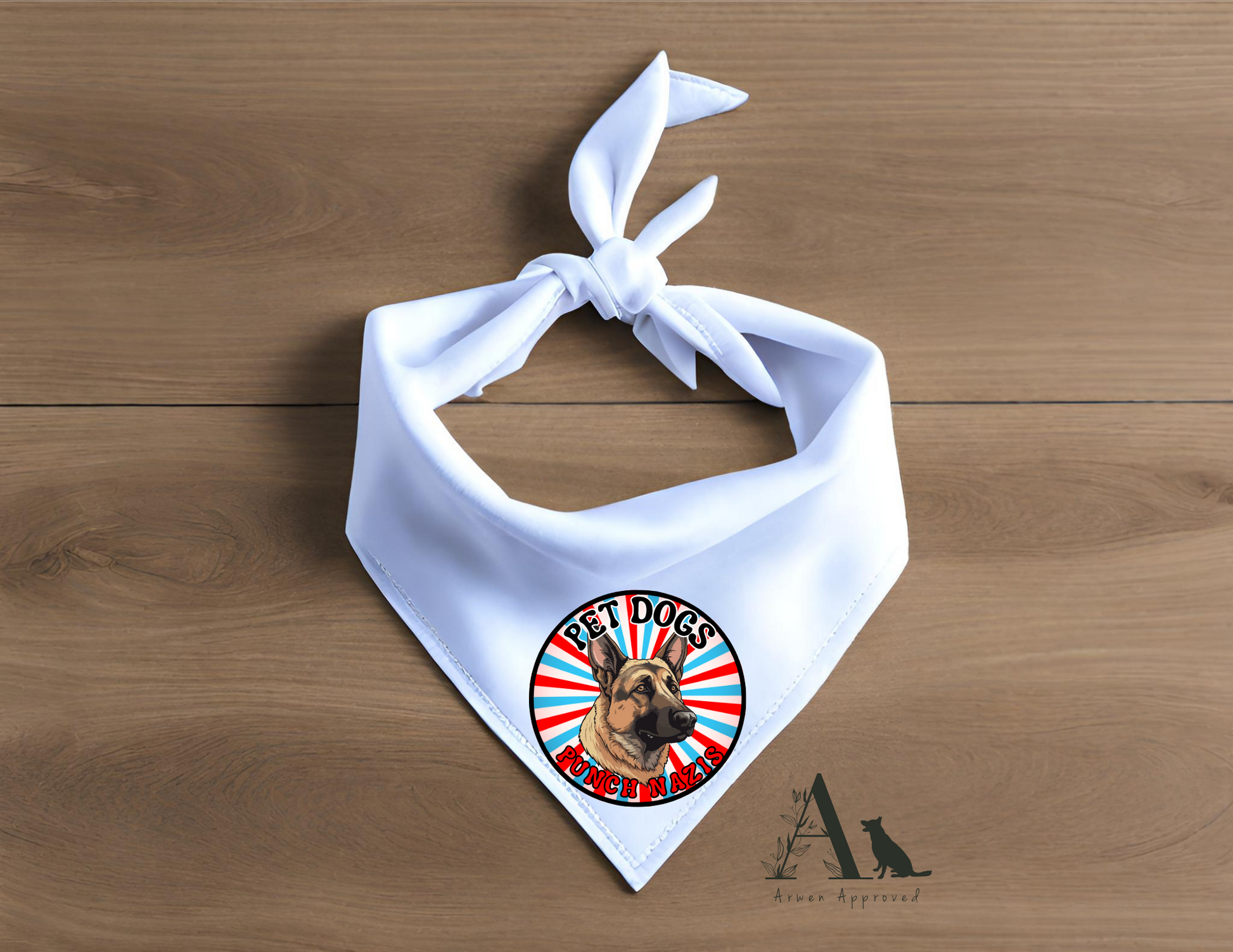White dog bandana with a circular design featuring a dog's face on a wooden surface