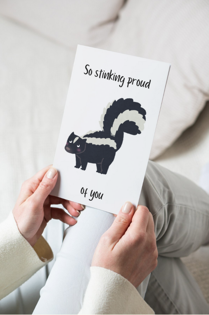greeting card with a skunk on it and the text so stinking proud of you