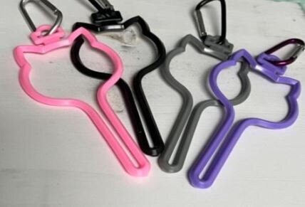 Dog head shaped hands free waste bag holders in 4 colors