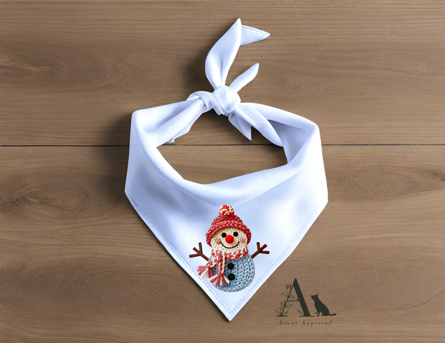 White bandana with a snowman design on a wooden surface