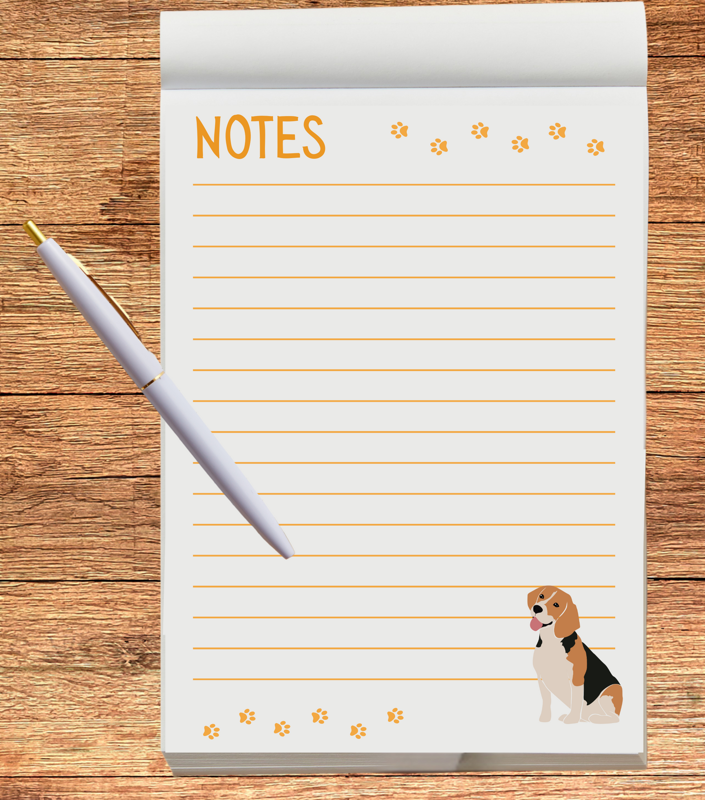 Notepad with lined pages and a dog illustration on a wooden surface with a pen.