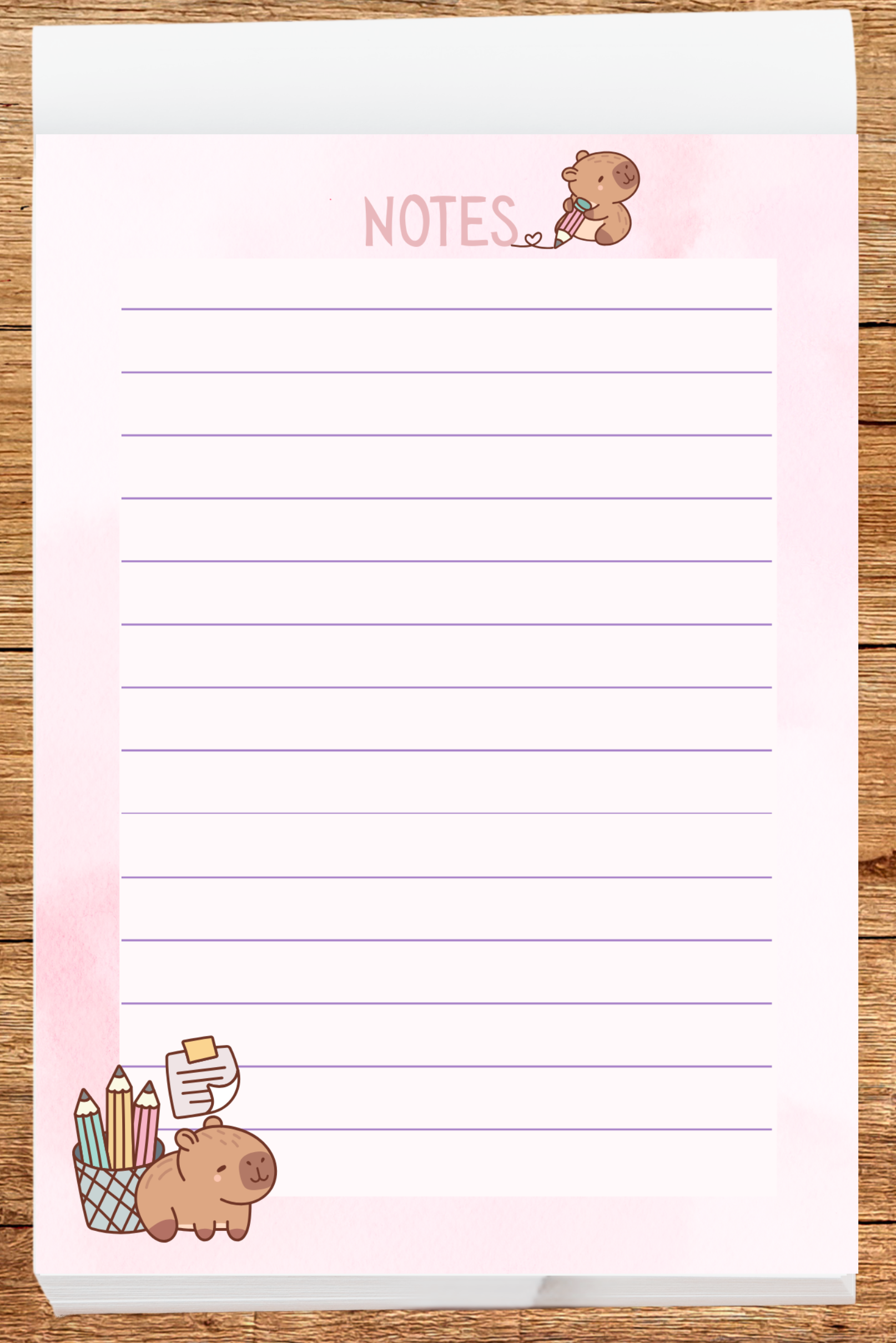 Notebook with capybaras and 'NOTES' text on a wooden surface