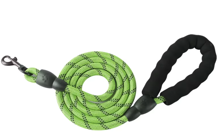 Green dog leash with black handle on a white background