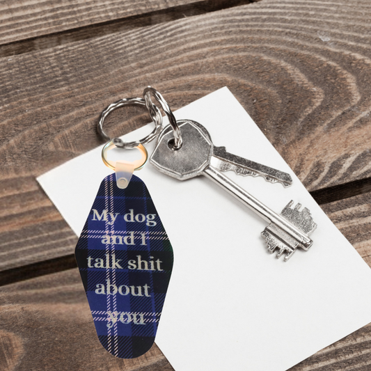 Keychain with a blue and white tag on a wooden surface