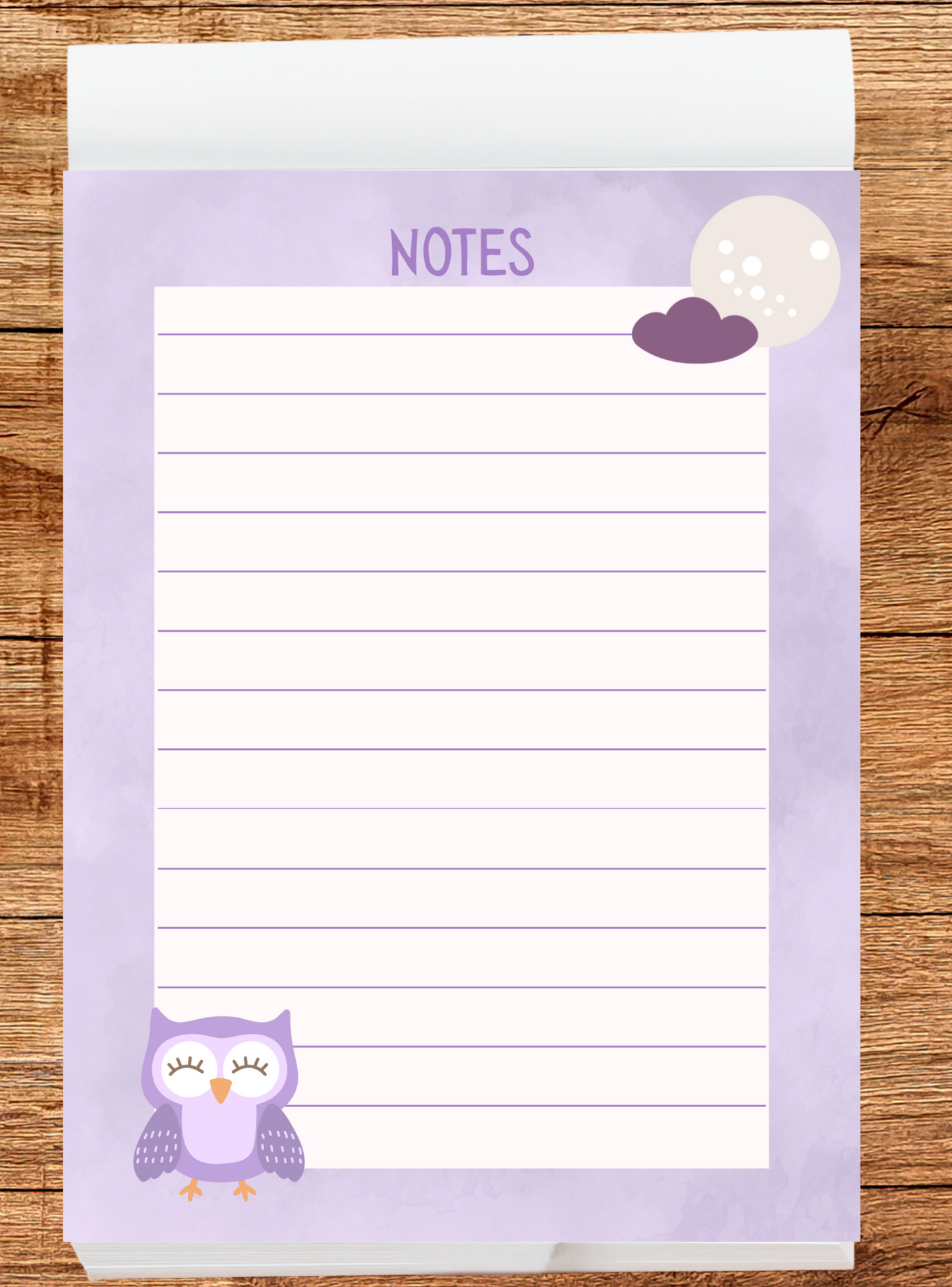 Notepad with owl design and 'Notes' text on a wooden surface