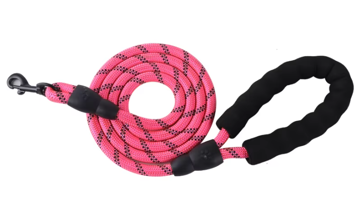 Pink dog leash with black handles on a white background
