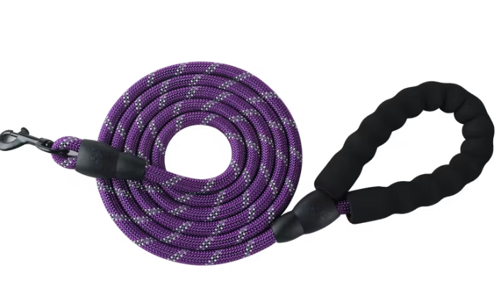 Purple dog leash with black handle on a white background