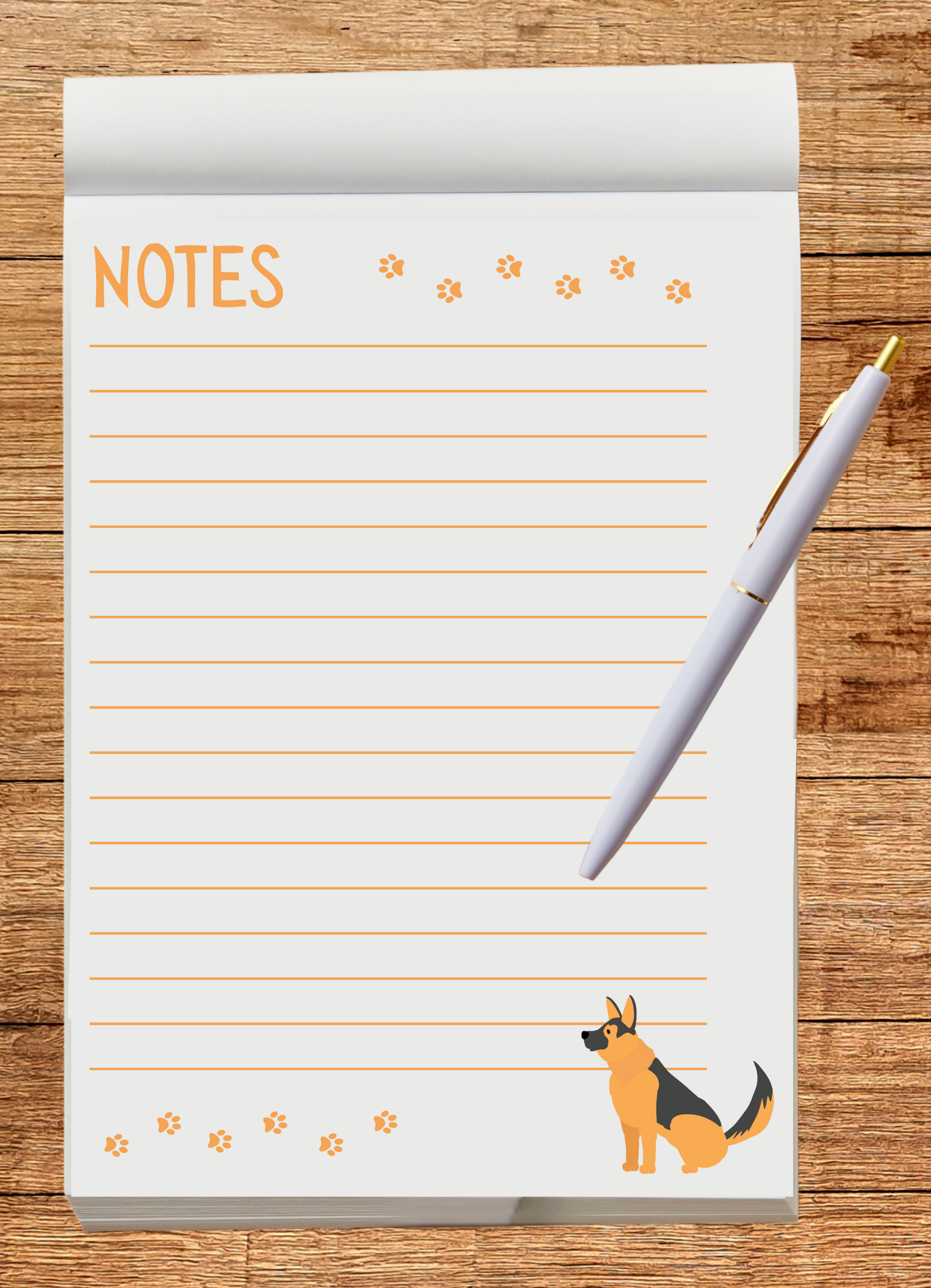 Notebook with a German Shepherd illustration and a pen on a wooden surface