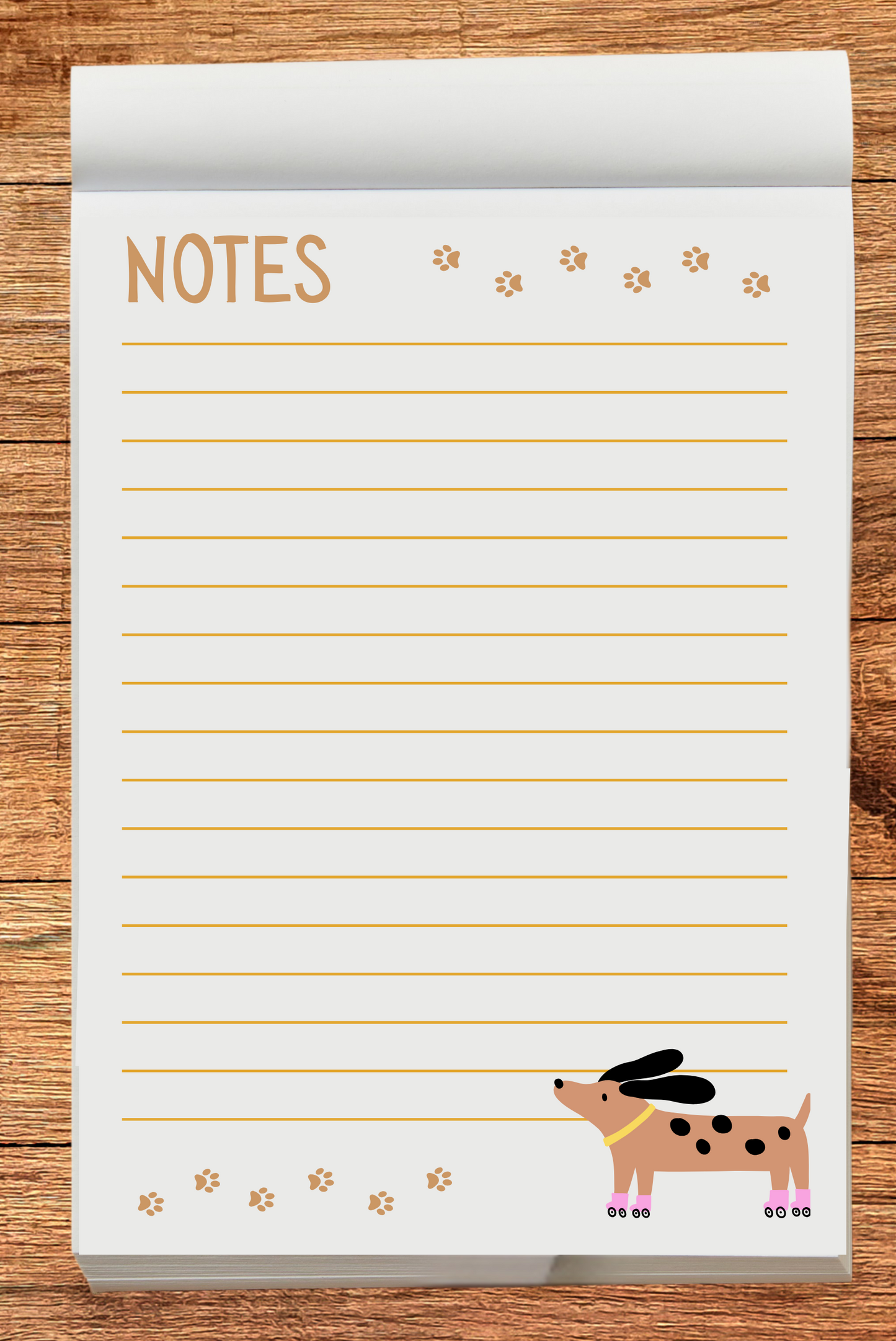 Notepad with a skating dog illustration and 'NOTES' text on a wooden surface